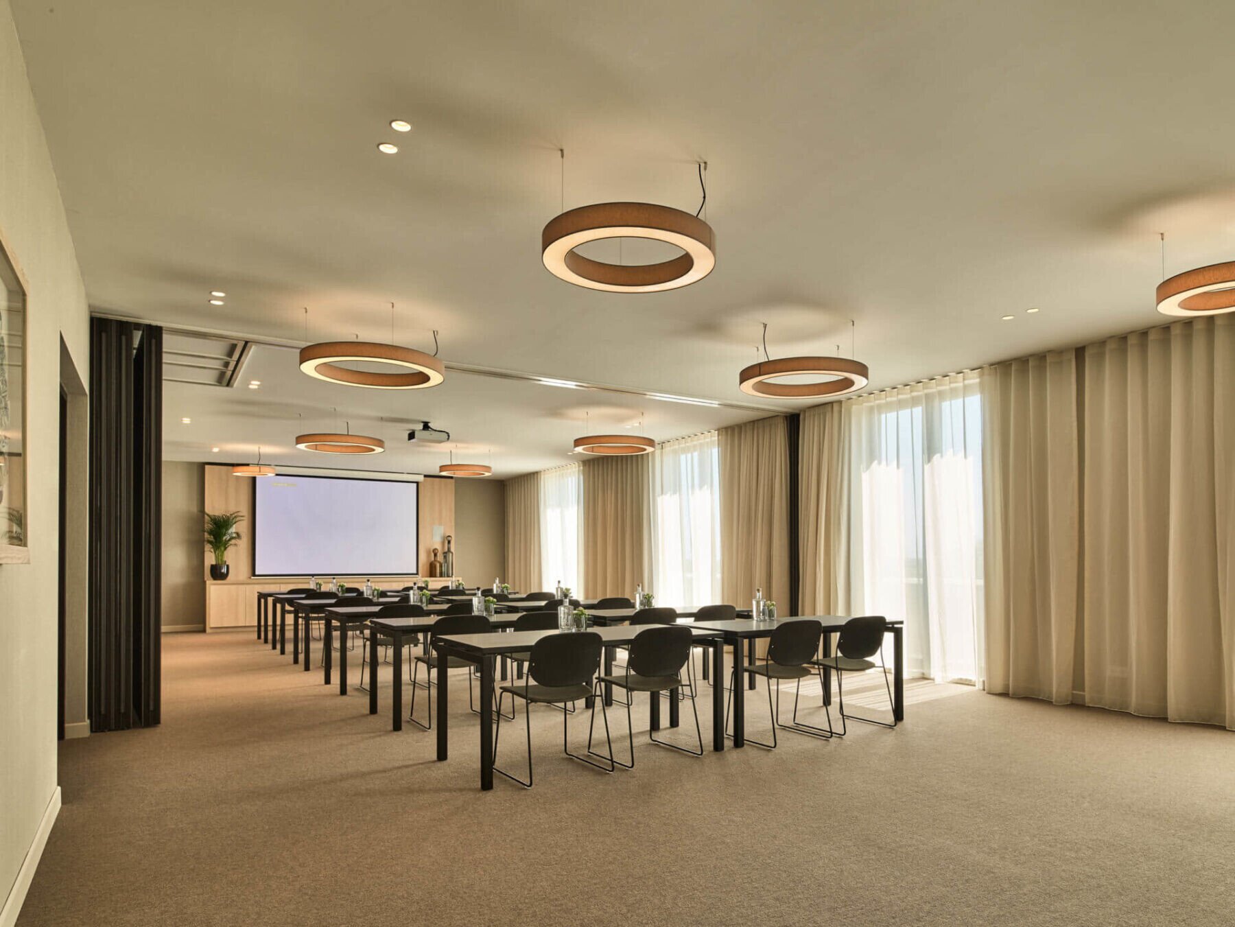 Zwinpolder meeting room in classroom setup with projection screen.
